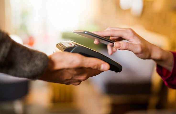 Phone being used for 'tap' payment on eftpos machine 